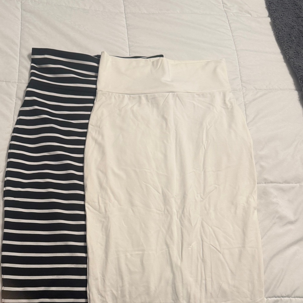 Bebe midi skirt bundle. Black and white striped and a solid white Skirt Set